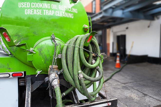 a pump truck emptying a grease trap in Buckley